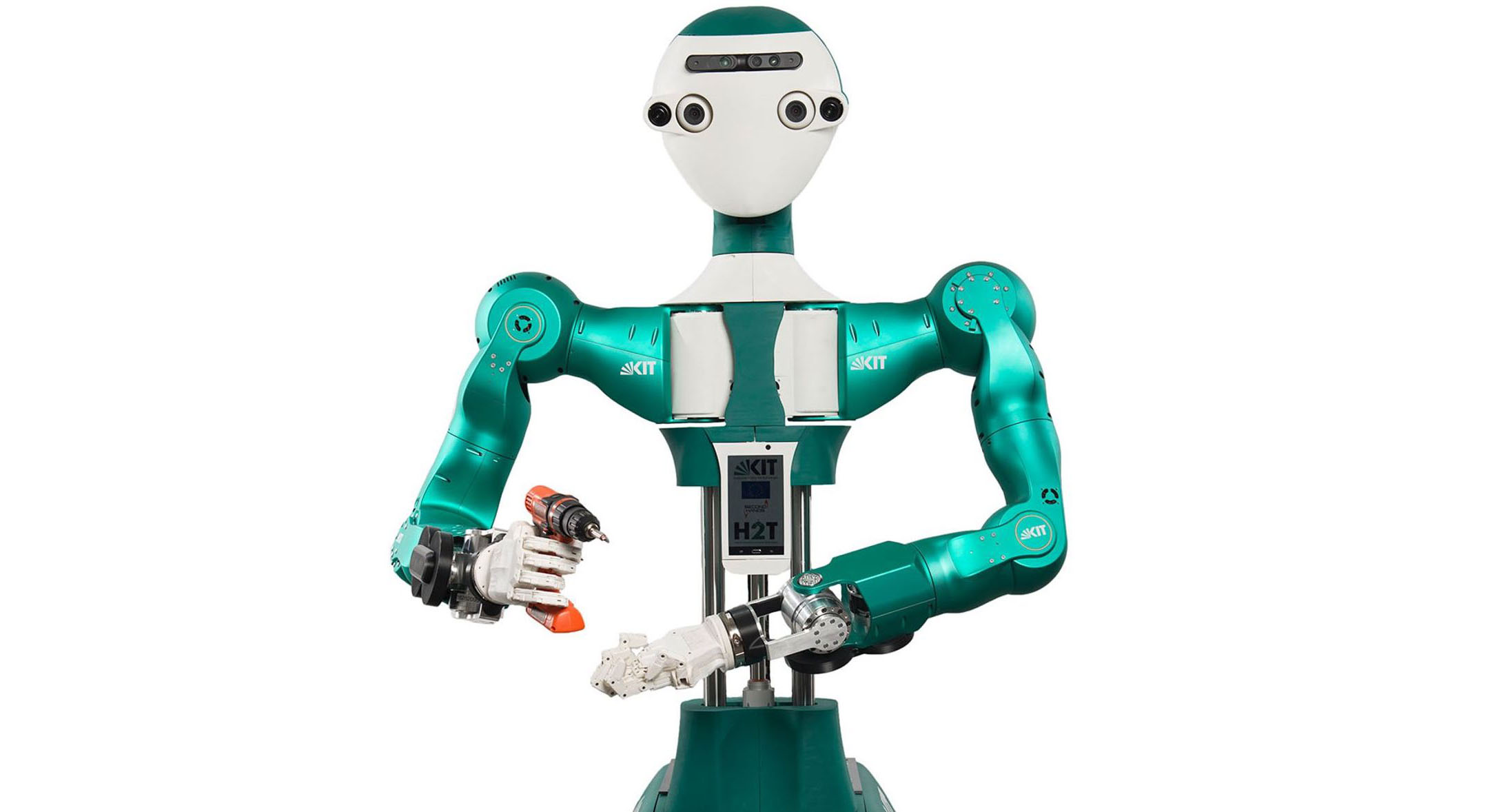 German humanoid robot Armar, with a green metal body and round face, holds a power drill.